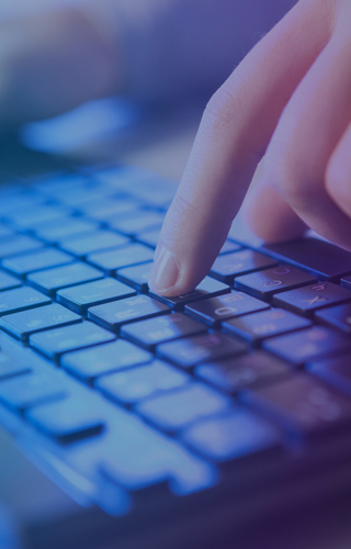 Hands typing on a keyboard